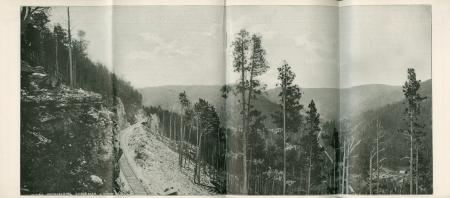 Approaching Spearfish Canyon, photograph from “Little Journeys in the Black Hills” brochure (1900) Photo "Approaching Spearfish Canyon" showing railway along mountain slope