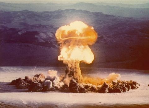 Tests of hundreds of nuclear weapons in the open air spread radioactive fallout from pole to pole—invisible cancer-causing isotopes that found their way into food and into human bodies. Public alarm was coming to a peak just when <i>Silent Spring</i> came out. <br /> <a target="_blank" rel="license" href="http://creativecommons.org/publicdomain/mark/1.0/"> <img src="http://i.creativecommons.org/p/mark/1.0/80x15.png" style="border-style: none;" alt="Public Domain Mark" /> </a> Photo courtesy of National Nuclear Security Administration / Nevada Site Office. Photo depicting mushroom cloud rising to the sky after detonation of nuclear bomb "Operation Plumbbob"